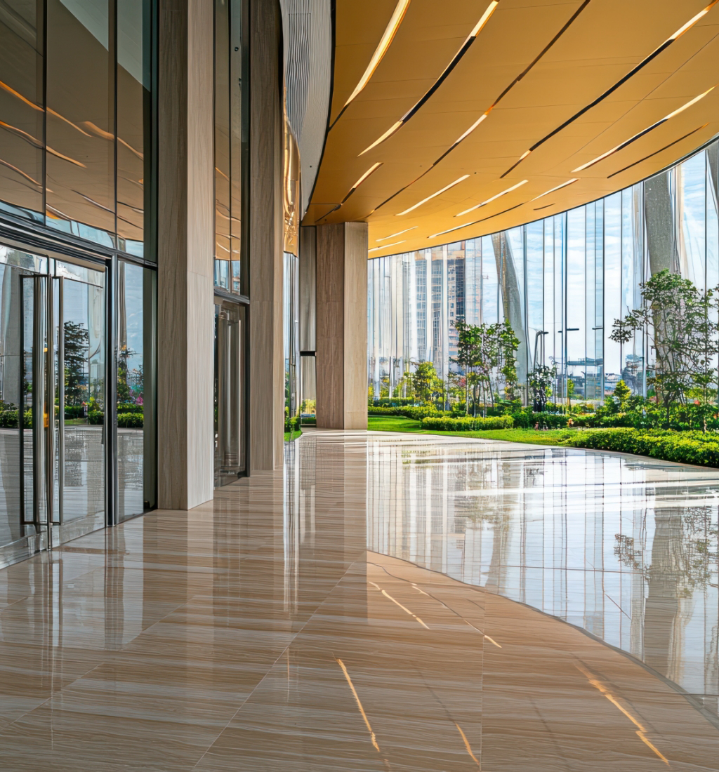 Entrance to a commercial building surrounded by green grass and landscaping, maintained by commercial property management services.